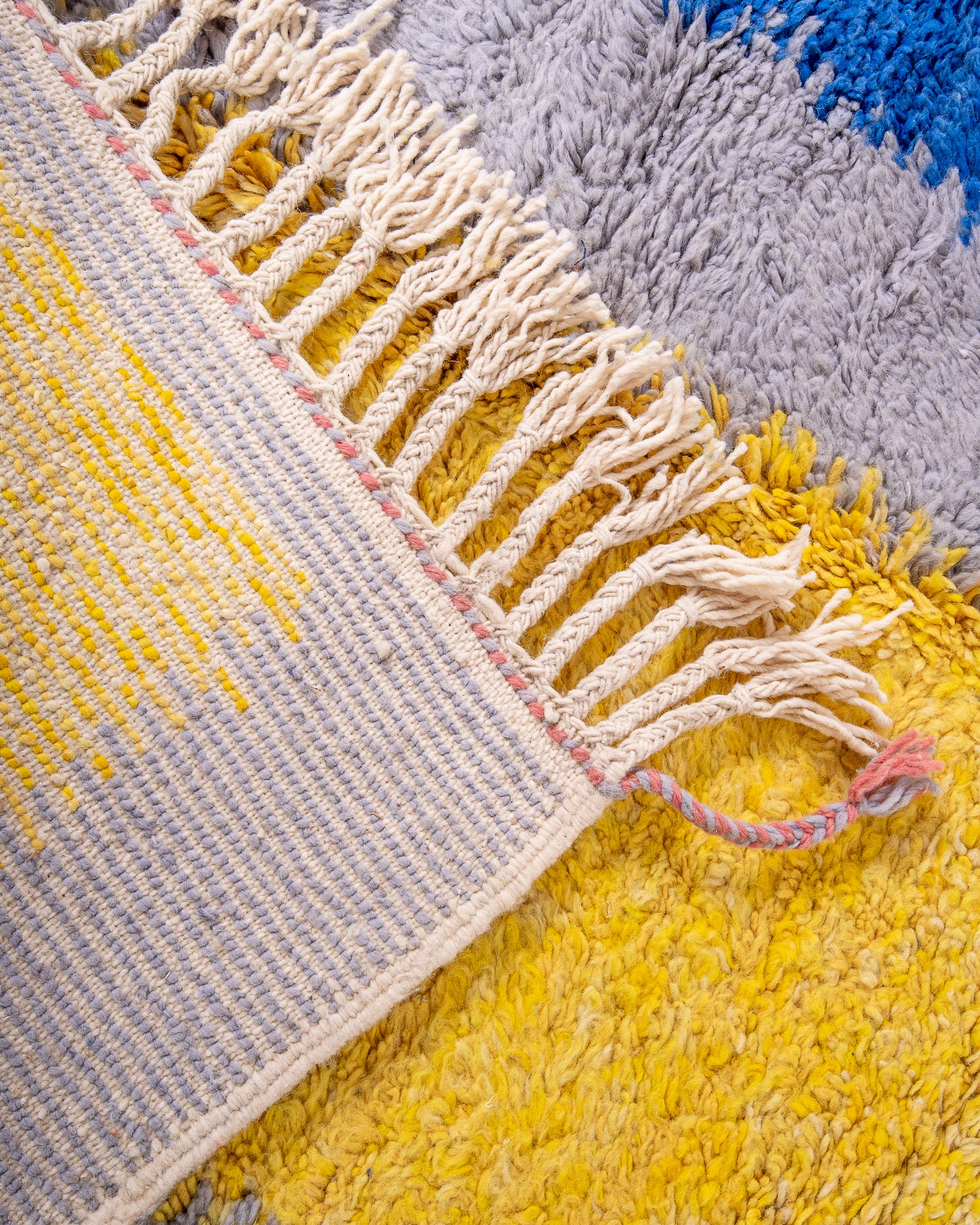 Modern, designer, handcrafted Berber rug from Morocco. Beniourain carpet with beautiful colours and patterns and fluffy wool texture.
